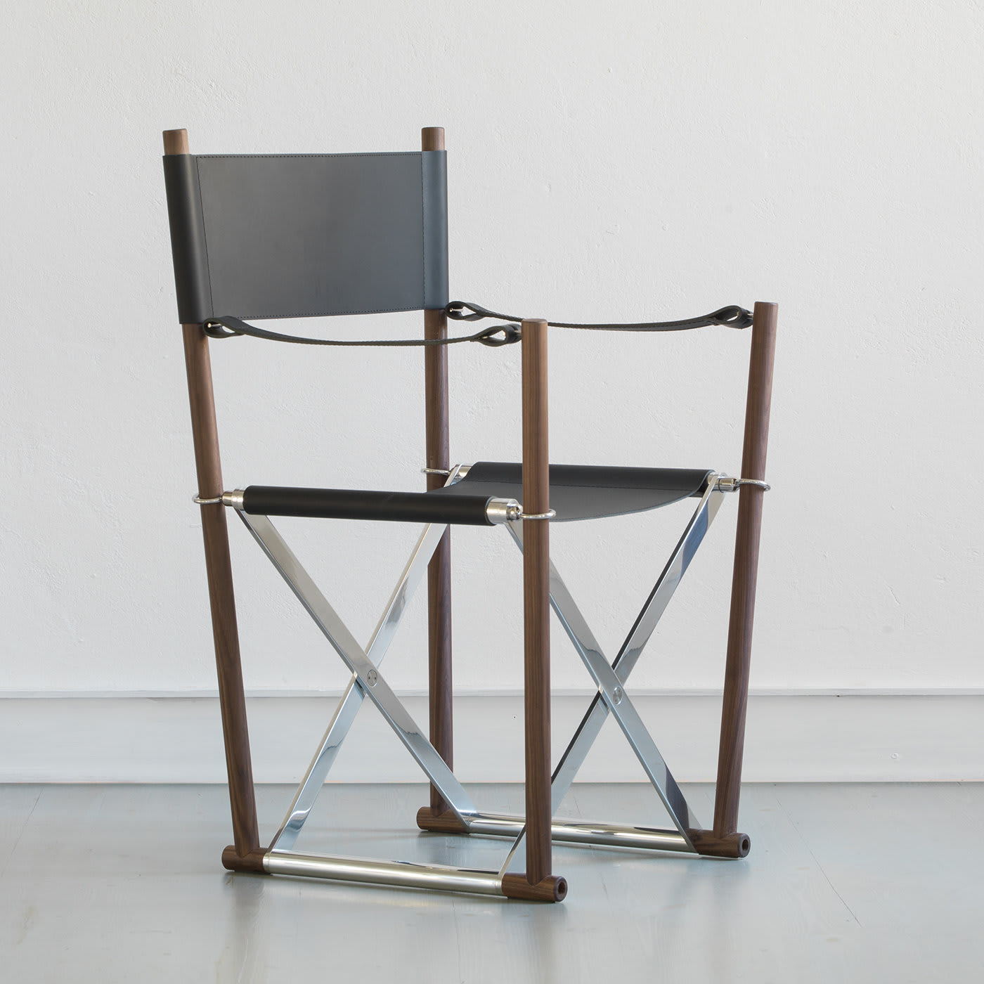 Sedia in Pelle Regista | Base / Piedistallo: Solid Black Walnut | Seduta: Pelle